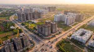 Aerial view of Navi Mumbai real estate development with under-construction towers and completed residential complexes