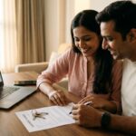 Couple reviewing flat buying documents and property agreement for a Navi Mumbai apartment purchase