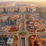 Aerial view of NAINA City development near Navi Mumbai International Airport showing planned infrastructure and construction progress