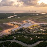 Aerial view of Navi Mumbai International Airport terminal at sunset in 2026