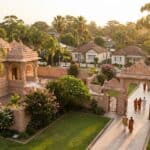 Traditional temple with ornate architecture in Navi Mumbai surrounded by greenery and devotees visiting