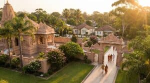 Traditional temple with ornate architecture in Navi Mumbai surrounded by greenery and devotees visiting