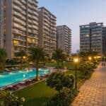 Well-maintained residential society in Navi Mumbai with swimming pool, landscaped garden and modern apartment buildings