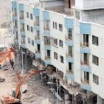 Old CIDCO building next to a new high-rise under construction in Navi Mumbai redevelopment