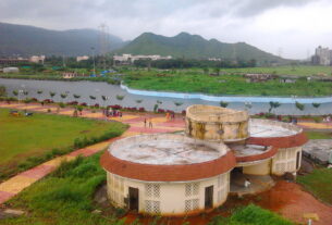 Central Park in Kharghar, Navi Mumbai, showing the lakeside walkway, garden pavilions and hills in the background.
