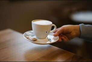 A cup of coffee being served at a cafe table; illustrative image, not a specific Navi Mumbai cafe