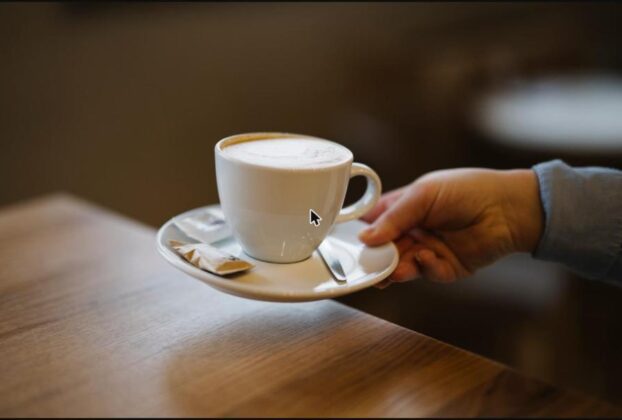 A cup of coffee being served at a cafe table; illustrative image, not a specific Navi Mumbai cafe