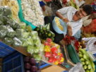 Illustrative vegetable market shopping scene. Not a documented Navi Mumbai household spending experiment.