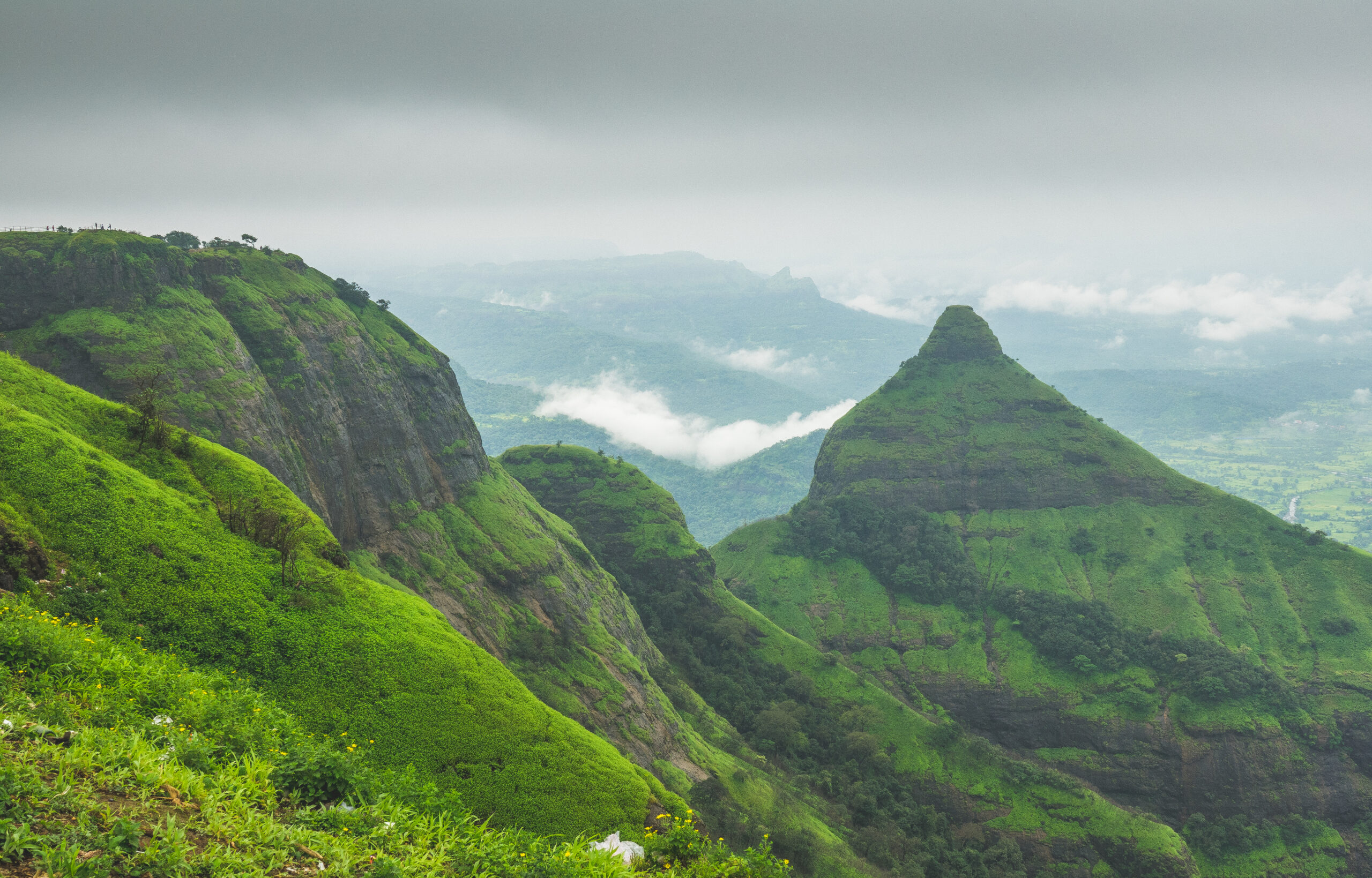 Misty green Sahyadri hill and valley view from Lion’s Point in Lonavala, a hill station near Mumbai and Navi Mumbai; illustrative landscape, not every destination in this guide