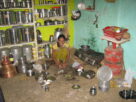 Illustrative photo of an ordinary Indian home kitchen with a gas stove and LPG cylinder. Not a photograph of a specific Navi Mumbai household.