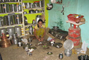 Illustrative photo of an ordinary Indian home kitchen with a gas stove and LPG cylinder. Not a photograph of a specific Navi Mumbai household.