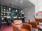 Interior of a salon with styling chairs and product shelving