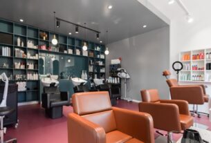 Interior of a salon with styling chairs and product shelving