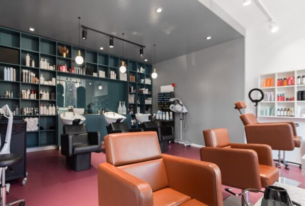 Interior of a salon with styling chairs and product shelving