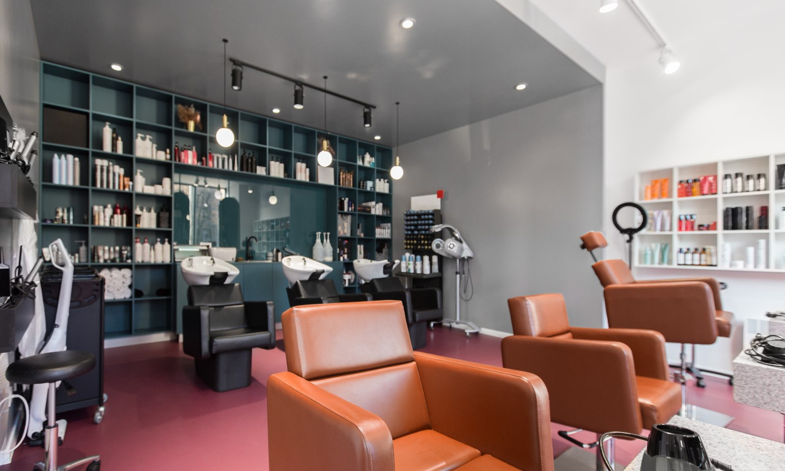 Interior of a salon with styling chairs and product shelving