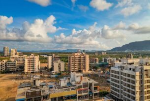 Skyline view of South Navi Mumbai from Dronagiri, showing residential towers against the hills.