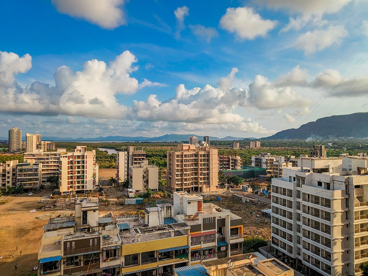 Skyline view of South Navi Mumbai from Dronagiri, showing residential towers against the hills.