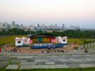 Open-air amphitheatre at Central Park in Kharghar with the city skyline behind