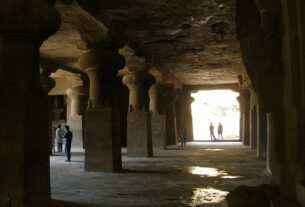 Pillared interior hall of a rock-cut cave at Elephanta Island