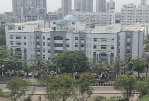 White academic block with blue domes at Terna Engineering College in Nerul