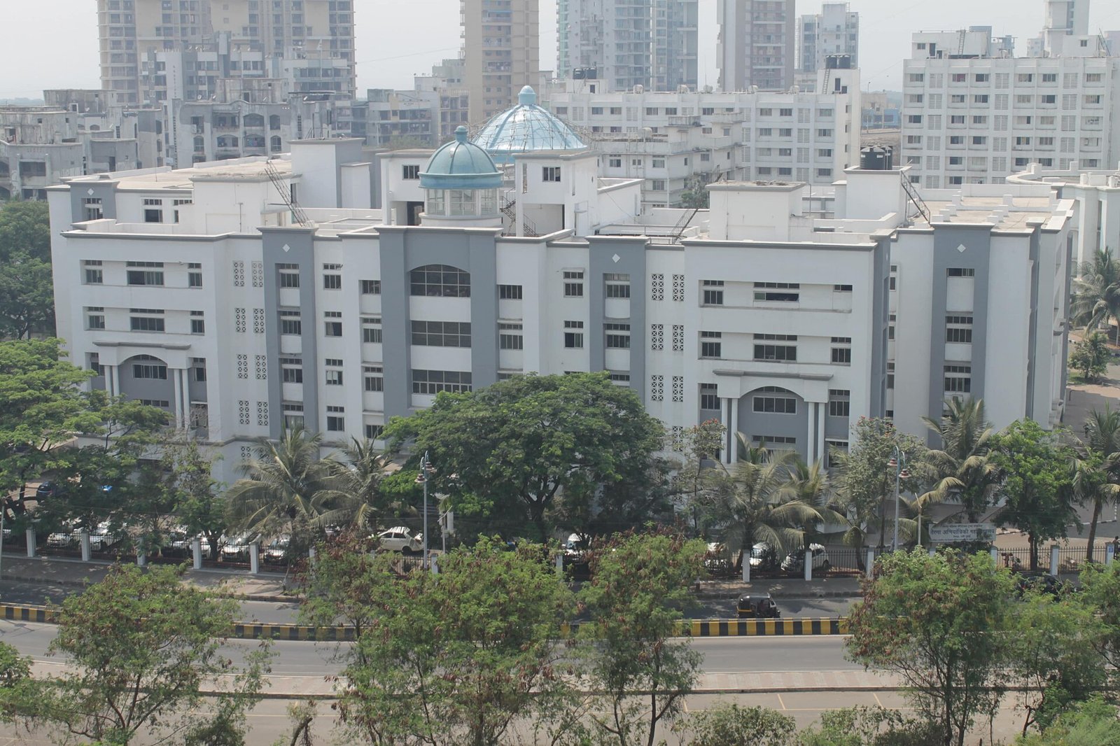White academic block with blue domes at Terna Engineering College in Nerul