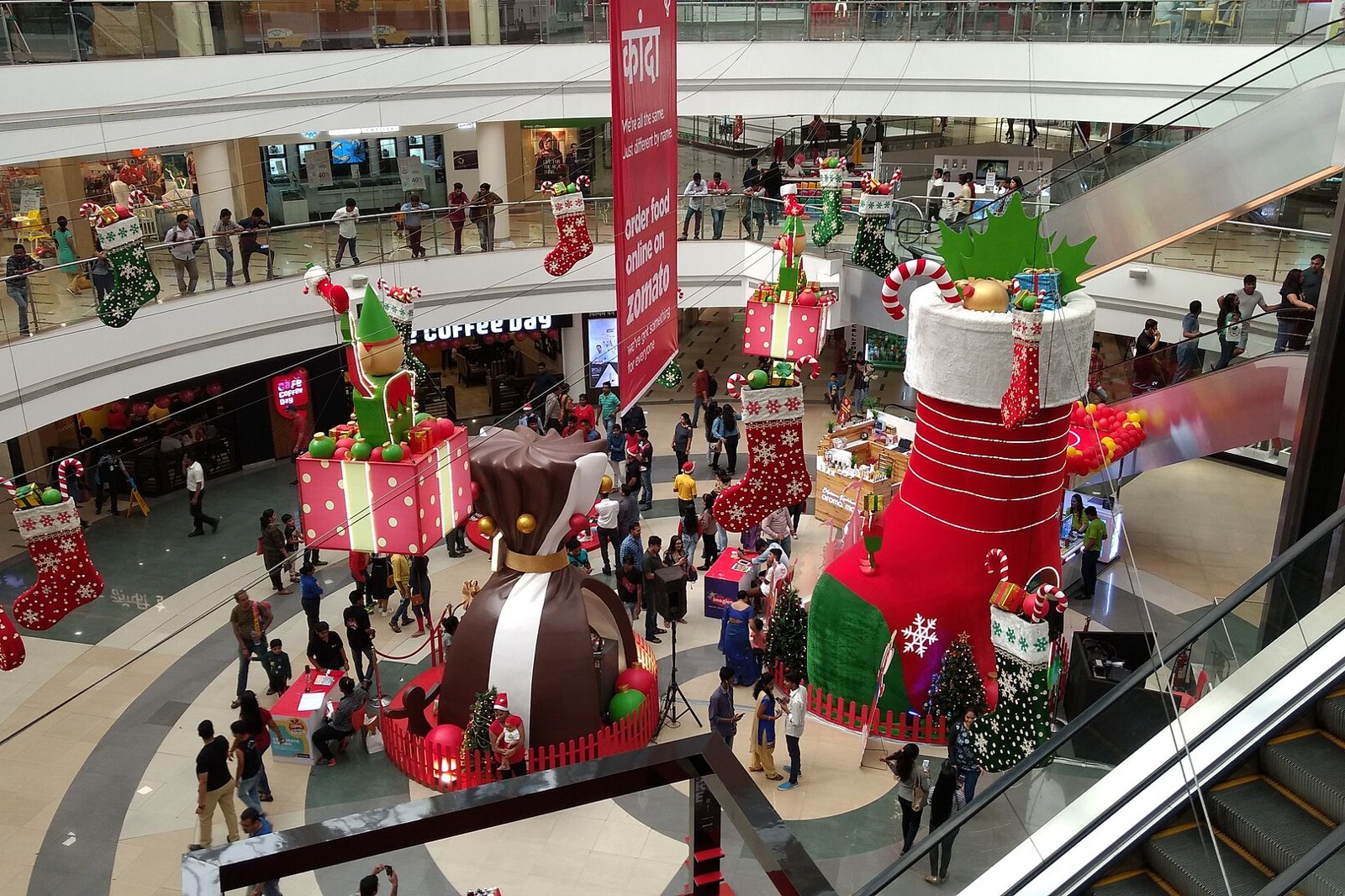 Shoppers gathered in the atrium of Inorbit Mall in Vashi under Christmas decorations