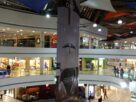Atrium of Inorbit Mall in Vashi with escalators, shoppers and festive decorations