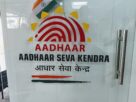 An Aadhaar Seva Kendra counter with applicants