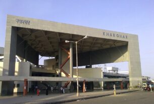 Entrance gate of Kharghar railway station with the station name in Marathi and English