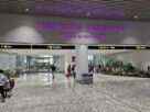 Arrivals area at Navi Mumbai International Airport with a Welcome to Navi Mumbai sign