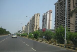 Palm Beach Road in Nerul with residential towers along the road