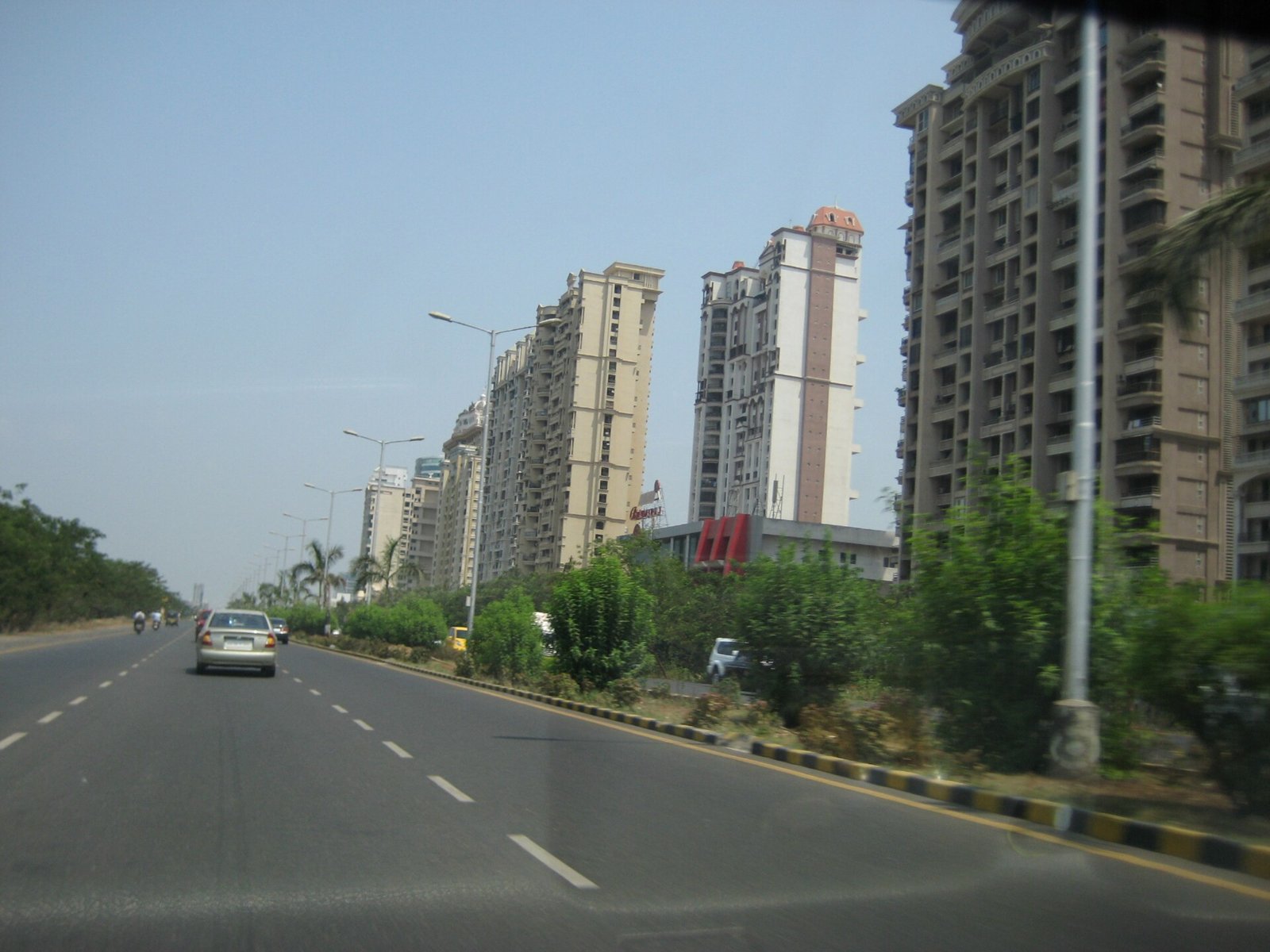 Palm Beach Road in Nerul with residential towers along the road