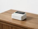 A fingerprint scanner on a counter in a bright office