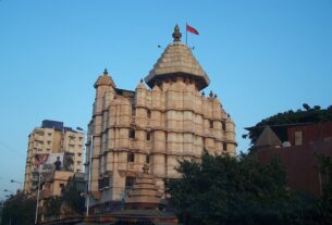 Exterior of the Siddhivinayak Temple in Prabhadevi, Mumbai, against a clear sky