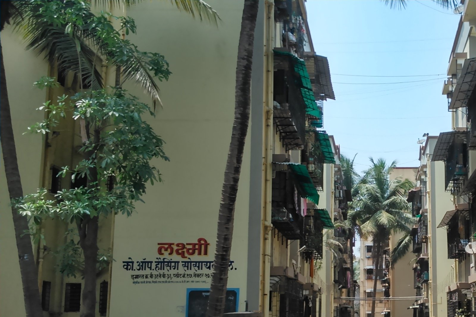 Marathi name board of a co-operative housing society on a building wall in Sector 10, Sanpada, Navi Mumbai
