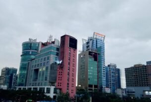 Office and commercial towers in Vashi under an overcast sky