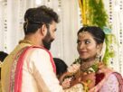 A bride and groom exchanging flower garlands during a wedding ceremony