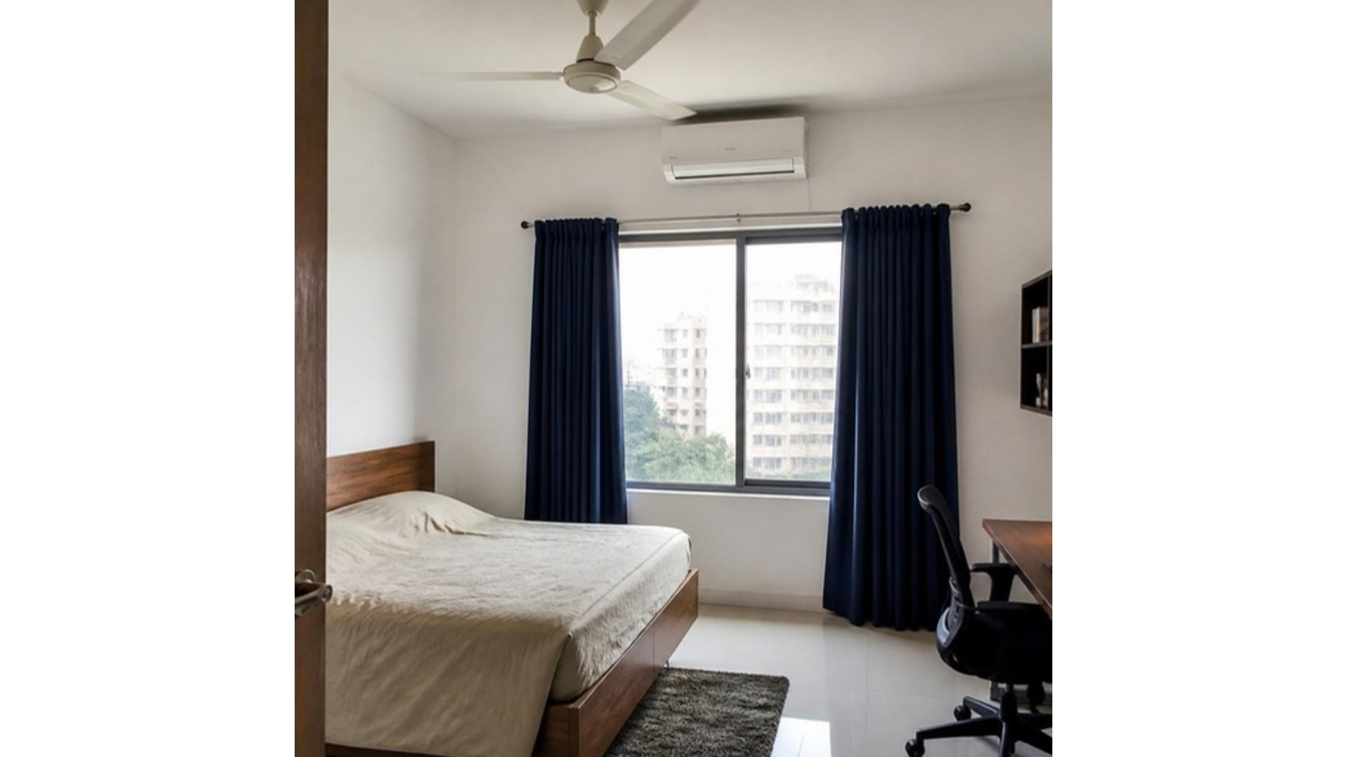White walls with navy blue curtains in an Indian apartment living room, AI-generated illustrative render